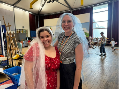 Two women with veils on their head for a wedding