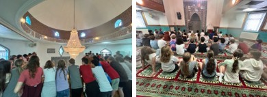 Children inside a mosque sitting on prayer mats