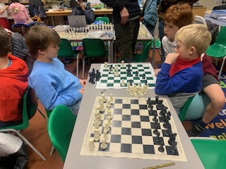 Two children playing Chess