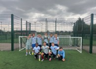 Group of boys in front of goal