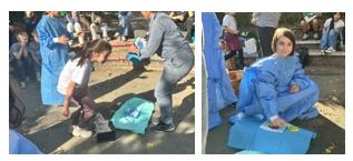 Children with a blue medical prop on the ground
