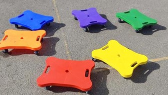 Colourful plastic seats with wheels to sit on and 'scoot'