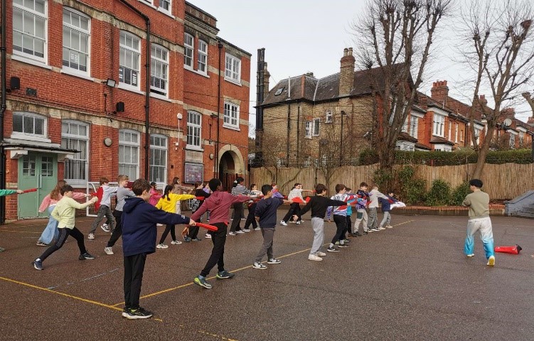Pupils in the playground learning kung fu