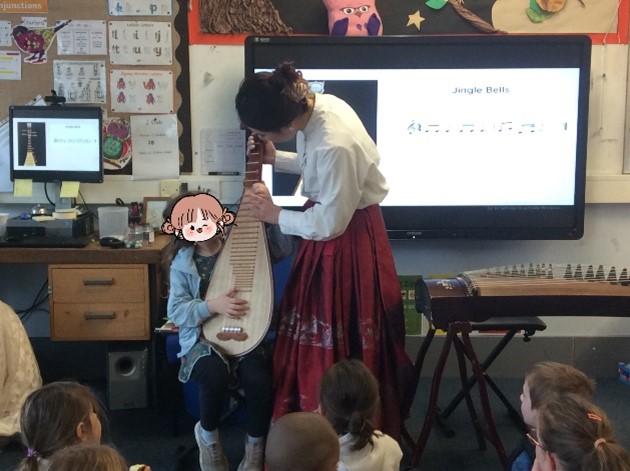 Girl playing chinese musical insrument