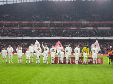 Tetherdown pupil serving as a mascot at the Arsenal vs Manchester United FA cup fixture